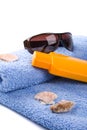 Towel, shells, sunglasses and lotion Royalty Free Stock Photo