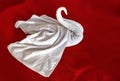 Towel swan shaped on the red bed