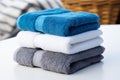 Towel trio Blue, white, and gray towels stacked for elegant presentation