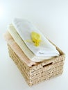 Towels in basket isolated Royalty Free Stock Photo