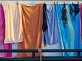 Towels and bathing swim suits drying on the clothesline