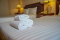 Towels and bedding on double beds in dormitories or guesthouse rooms that are empty Royalty Free Stock Photo