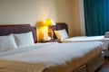 Towels and bedding on double beds in dormitories or guesthouse rooms that are empty Royalty Free Stock Photo