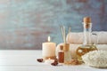 Towels, candle and massage oil on white table Royalty Free Stock Photo