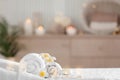 Towels and candles on massage table in modern salon. Place for relaxation Royalty Free Stock Photo