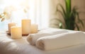 Towels and candles on massage table in spa salon. Place for relaxation Royalty Free Stock Photo