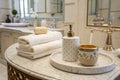 Towels and ceramics on marble table in bathroom Royalty Free Stock Photo