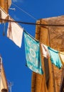 Towels hanging on a clothes line in Corfu Old Town Royalty Free Stock Photo