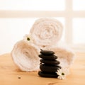 Towels and masage rocks on table in spa salon Royalty Free Stock Photo