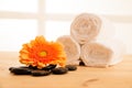 Towels and masage rocks on table in spa salon