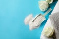 Towels, roses and scoop with washing powder on blue background Royalty Free Stock Photo