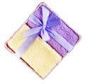 Towels tied white ribbons placed in the basket. Royalty Free Stock Photo