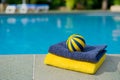 Towels and toys near the swimming pool Royalty Free Stock Photo