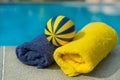 Towels and toys near the swimming pool Royalty Free Stock Photo
