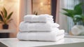 Towels on white marble desk in the foreground and blurred modern bathroom Royalty Free Stock Photo