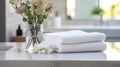 Towels on white marble desk in the foreground and blurred modern bathroom Royalty Free Stock Photo