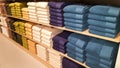 Towels on wooden shelves in shop