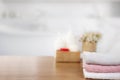 Towels on wooden top table with copy space on blurred bathroom background Royalty Free Stock Photo