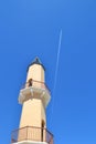 Tower Against Clear Blue Sky with Vapour Trail, Fuengirola, Spain. Royalty Free Stock Photo