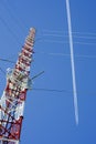 Tower, airplane and contrail Royalty Free Stock Photo