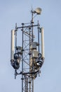 Tower with antennas and transmitters against a blue sky Royalty Free Stock Photo