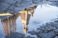 Tower bell reflection in a water puddle after the rain Royalty Free Stock Photo