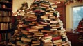 A Tower of Books Arranged in the Shape of a Christmas Tree Royalty Free Stock Photo