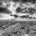 Tower Bridge and city skyline along river Thames at night, aerial view - London - UK Royalty Free Stock Photo