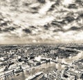 Tower Bridge and city skyline along river Thames at night, aerial view - London - UK Royalty Free Stock Photo