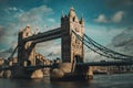 Tower Bridge in a dark blue sky with birds flying by and pedestrians and vehicles crossing it. Royalty Free Stock Photo