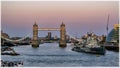 The Tower bridge and HMS Belfast in London in the dusk