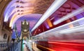 Tower Bridge in London with blurred red bus passing by Royalty Free Stock Photo