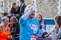 TOWER BRIDGE, LONDON, ENGLAND - 03 October 2021: Participant dressed as the queen running in the Virgin Money London Marathon 2021