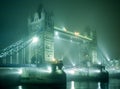 Tower Bridge in fog at night Royalty Free Stock Photo