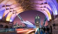 On the Tower Bridge in London after sunset with blurred red bus passing by Royalty Free Stock Photo