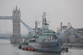 A military ship or boat on Thames River close to the Tower Bridge in London, United Kingdom Royalty Free Stock Photo
