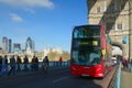 Tower Bridge perspective view with red bus, London