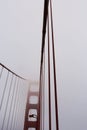 The tower and cables of the Golden Gate Bridge shrouded in fog, San Francisco, California Royalty Free Stock Photo