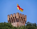 Tower of Carrarese Castle in Este, red and yellow flag. Padova, Italy