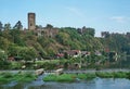 Castle ruins tower above a river Royalty Free Stock Photo