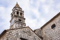 Tower of the Cathedral with a clock on the island of Vis, Croatia Royalty Free Stock Photo