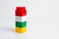 Tower from childrens constructor isolate on white background with copy space from the right Royalty Free Stock Photo