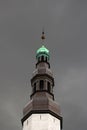 The tower of the Church of the Holy Ghost or Church of the Holy Spirit over grey sky, Tallinn, Estonia Royalty Free Stock Photo