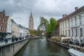 The tower of the church of Our Lady and Dijver in Bruges. Royalty Free Stock Photo