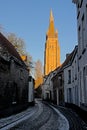 Tower of the church of our Lady in the winter evening sun in Bruges Royalty Free Stock Photo