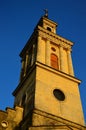 Tower of classicistic German evengelic church in Modra with typical square shape and columns, sunbathing in spring sunshine.