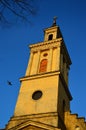 Tower of classicistic German evengelic church in Modra with typical square shape and columns, sunbathing in spring sunshine.