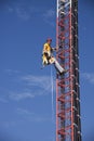 Tower climber ascending the guyed tower Royalty Free Stock Photo