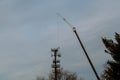 Tower climber and working on cellular tower system. Royalty Free Stock Photo