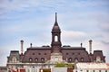 The tower, clock and roof of Montreal city hall hotel de ville against bright cloudy sky in old Montreal Royalty Free Stock Photo